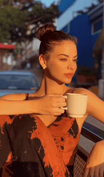 Virgina drinking coffee