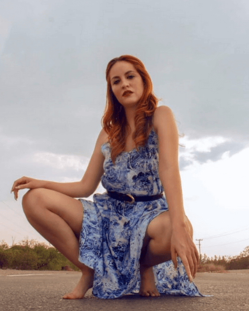 Mafer wearing blue and white dress