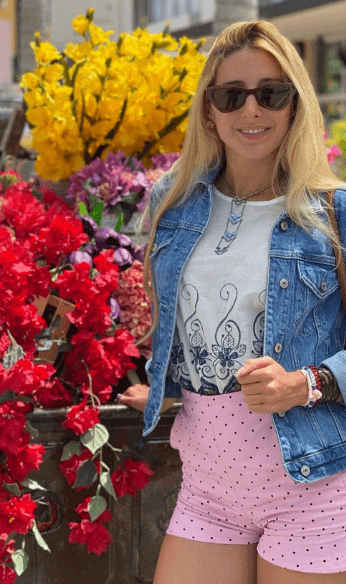 Antonella wearing jean top with pink